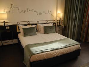 Кровать или кровати в номере Hotel Giò Wine e Jazz Area +36 фотографий