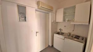 Kuchyň nebo kuchyňský kout v ubytování Apartments Mandalinic