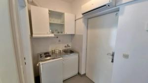 Kuchyň nebo kuchyňský kout v ubytování Apartments Mandalinic