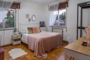 Łóżko lub łóżka w pokoju w obiekcie Piso con excelentes vistas