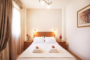 Postel nebo postele na pokoji v ubytování Hotel Paralio