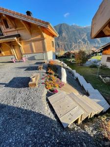 a group of benches in front of a building at Gîte Au Balcon de Passy/Plaine Joux, classé 2 ** in Passy +12 photos