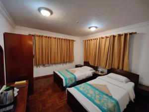 Letto o letti in una camera di Sherpa Home Hotel