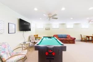 a living room with a pool table in it at Eastwind Elegance in Ogunquit