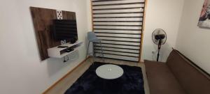 TV a/nebo společenská místnost v ubytování APART HOTEL EN BULNES