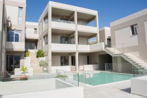 an image of an apartment building with a swimming pool at Bali Diamond "by Checkin" Adults Only in Bali