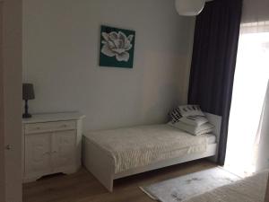 Łóżko lub łóżka w pokoju w obiekcie Apartament IGA