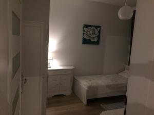 Łóżko lub łóżka w pokoju w obiekcie Apartament IGA