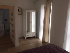 Łóżko lub łóżka w pokoju w obiekcie Apartament IGA