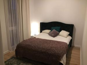 Łóżko lub łóżka w pokoju w obiekcie Apartament IGA