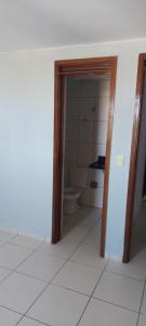 an empty room with a bathroom with a toilet at Residencial Amazonia Apto 1205 in João Pessoa