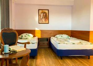מיטה או מיטות בחדר ב-Noclegi Prestige