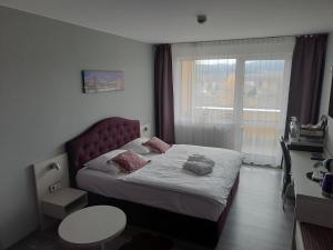 Postel nebo postele na pokoji v ubytování Apartmány - Frymburk My Family