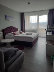 Postel nebo postele na pokoji v ubytování Apartmány - Frymburk My Family