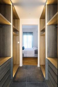 A bed or beds in a room at Blue Delta Apartment Palaio Faliro