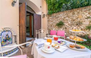a table with plates of food on a patio at Nice Apartment In Verucchio With Kitchen in Verucchio