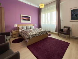 A seating area at ABT Apartments Karoly