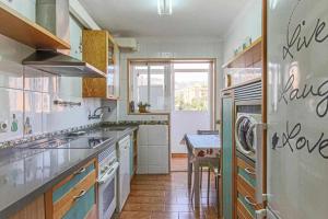 a kitchen with a sink and a stove top oven at 797 Holiday Rentals - Espacioso apartamento para 6 en torremolinos in Torremolinos