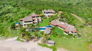 an aerial view of a house on the beach at Beautiful Family House Beachfront 