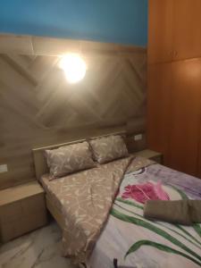 Postel nebo postele na pokoji v ubytování GCM 2 ROOMS kentro