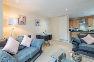 a living room with a couch and a table at Apartment 8 in Worksop