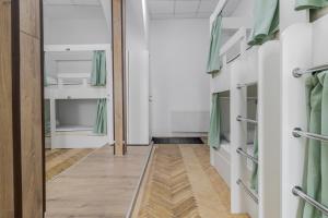 a hallway with bunk beds in a room at In Town hostel in Lviv +52 photos
