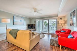 a living room with a couch and two chairs at Bright Carolina Beach Condo - Walk to Shore! in Carolina Beach