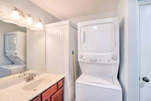 a bathroom with a washer and dryer and a sink at Remodeled Harrison Retreat Less Than 6 Mi to Town! in Harrison +19 photos