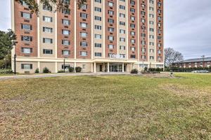 un gran edificio con un campo de césped delante de él en Airy Studio Situated in the Coosa River Area!, en Gadsden