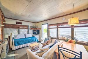 a living room with a bed and a table at Coastal Perry Cottage about 2 Mi to Boat Ramp! in Perry