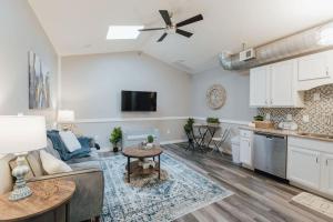 a kitchen and living room with a couch and a table at The Sanctuary Company Johnson City in Johnson City