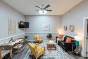 a living room with a couch and a table at The Sanctuary Company Johnson City in Johnson City