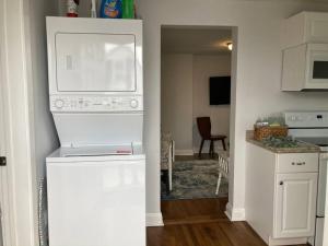 a kitchen with a microwave and a kitchen with a table at The Rustic Retreat- close to downtown in Bristol