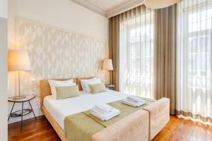 Postel nebo postele na pokoji v ubytování Traça Apartments by DA'HOME