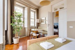 Postel nebo postele na pokoji v ubytování Traça Apartments by DA'HOME