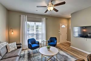 a living room with a couch and chairs and a ceiling fan at Ideally Located and Elegant Condo with Balcony! in Tallahassee