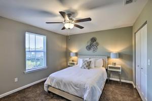 a bedroom with a bed and a ceiling fan at Ideally Located and Elegant Condo with Balcony! in Tallahassee