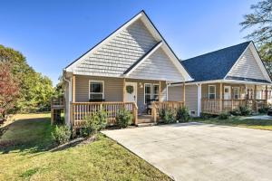 a house with a porch and a driveway at Family-Friendly Greer Home with Balcony and Yard! in Greer