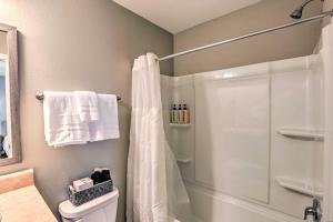 a bathroom with a shower and a toilet at Airy Tallahassee Condo about 5 Mi to Downtown! in Tallahassee