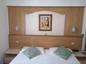 Postel nebo postele na pokoji v ubytování Hotel Villa Milano