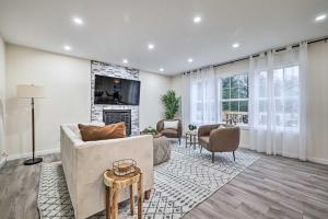 a living room with a couch and a fireplace at Community Beach and Lake Pocono Summit Escape in Pocono Summit