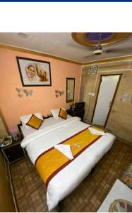 a bedroom with a large bed in a room at Hotel Desert in Jaisalmer