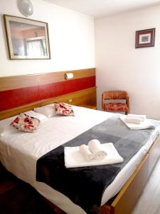 Postel nebo postele na pokoji v ubytování Hotel Villa Milano