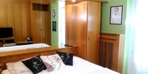 Postel nebo postele na pokoji v ubytování Hotel Villa Milano