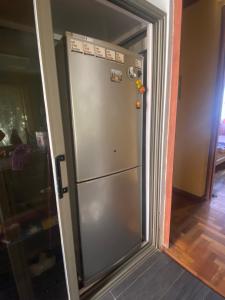 a stainless steel refrigerator in a room at 2 pokojový byt ve Flic en Flac Mauricius in Flic-en-Flac