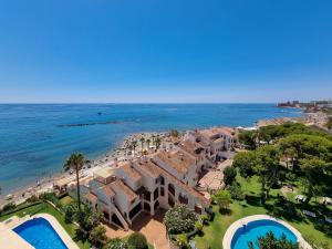 an aerial view of a resort and the beach at Spectacular Sea Views Benalmádena in Benalmádena