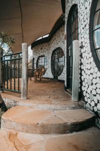 an outdoor patio with a table and chairs at Saab Royale Resort in Kajiado