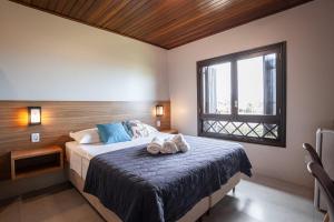 Uma cama ou camas num quarto em Parador Casa da Praia