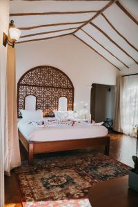 a bedroom with a large bed in a room at Saab Royale Resort in Kajiado