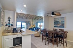 a kitchen and dining room with a table and chairs at Oceanfront Views, Heated Pool, Hot Tubs, Parking in Solana Beach
